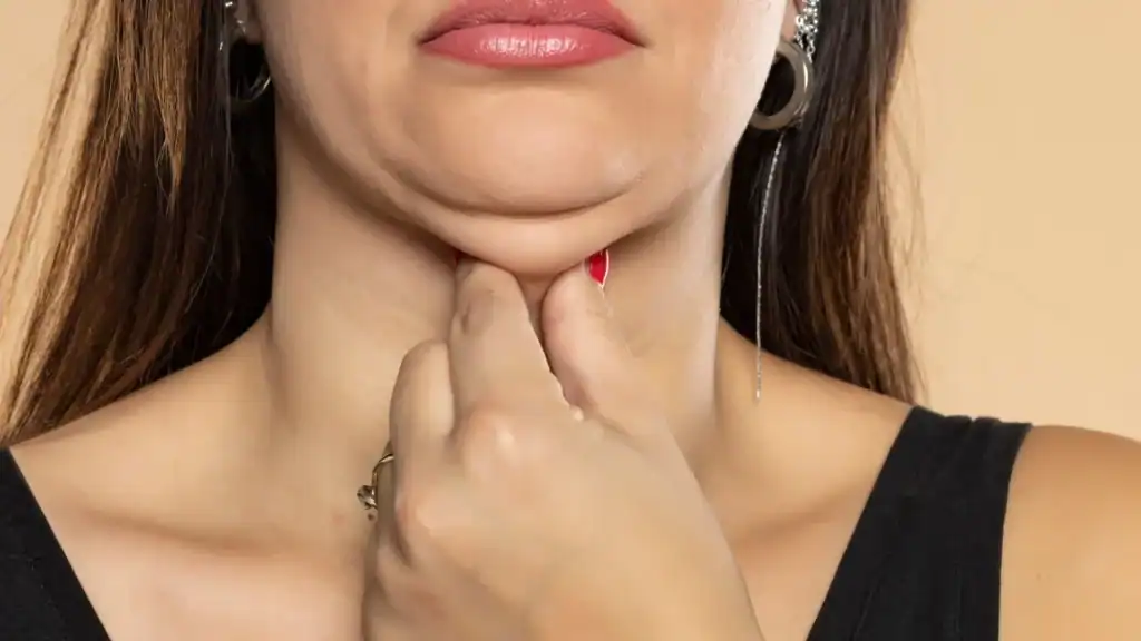 An image of a woman with double chin, sad, worried : Non Surgical Double Chin Removal Treatment in Rushden, UK